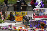 People gather in Jefferson Square awaiting word on charges against police officers, Wednesday, Sept. 23, 2020, in Louisville, Ky. A grand jury has indicted one officer on criminal charges six months after Breonna Taylor was fatally shot by police in Kentucky. The jury presented its decision against fired officer Brett Hankison Wednesday to a judge in Louisville, where the shooting took place.(AP Photo/Darron Cummings)