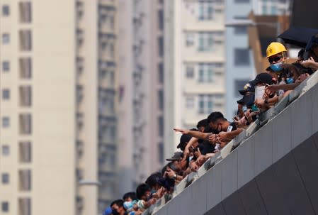 Demonstrators attend a protest in Hong Kong