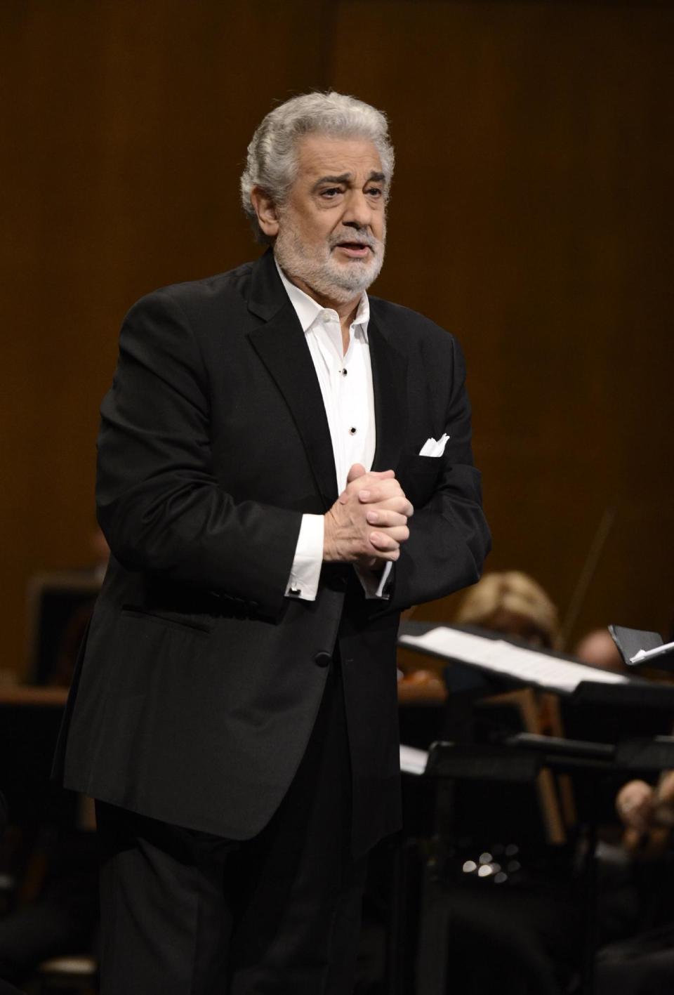 FILE - In this June 7, 2013 file photo, tenor Placido Domingo performs at the Dorothy Chandler Pavilion in Los Angeles. Domingo is in the hospital after suffering a blockage in an artery of the lungs. Domingo's publicist says the 72-year-old is expected to make a full recovery but will have to miss at least two appearances scheduled for later this month. He was admitted to the hospital Monday, July 8, 2013, in Madrid. (Photo by Dan Steinberg/Invision/AP, File)