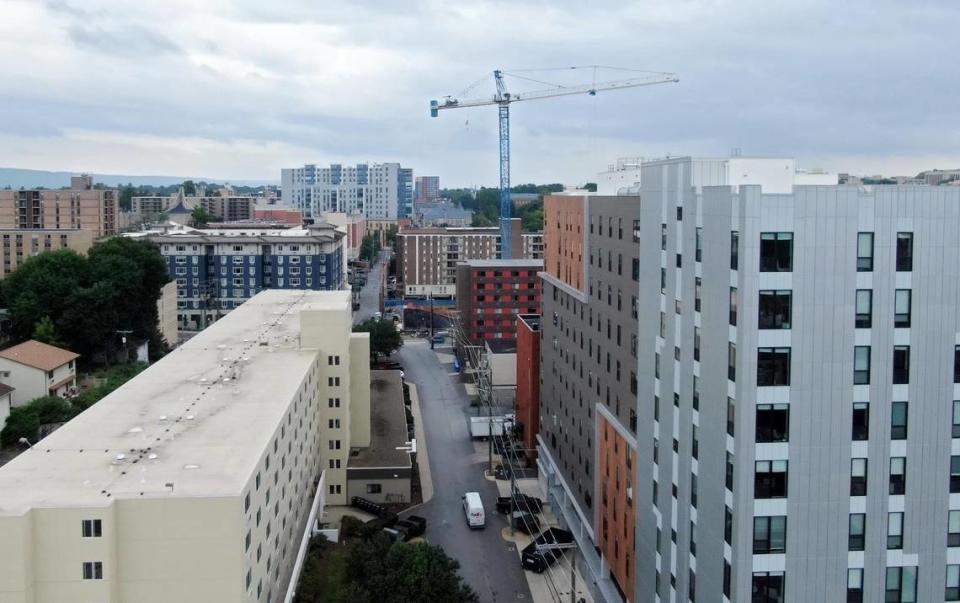 An aerial look at some of the high rises and construction for a new building on the east end of downtown State College on Wednesday, July 27, 2022.