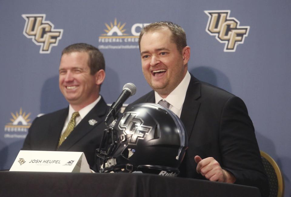 Josh Heupel (R) replaced Scott Frost as Central Florida’s head coach. Will Heupel keep UCF’s undefeated run going? (AP file photo)