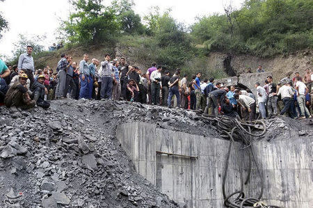 People gather at the site of an explosion in a coal mine in Golestan Province, in northern Iran. Tasnim News Agency/via REUTERS