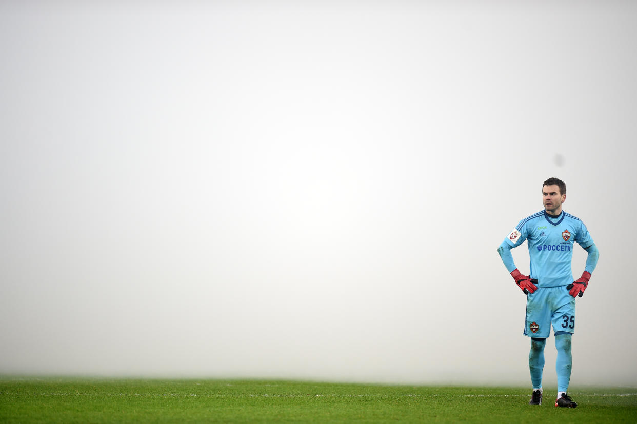 CSKA Moscow goalkeeper Igor Akinfeev stands in front of a wall of smoke during the derby at Spartak Moscow. (Getty)