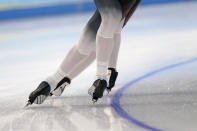 Athletes from Germany skate during a speedskating practice session ahead of the 2022 Winter Olympics, Thursday, Feb. 3, 2022, in Beijing. (AP Photo/Gerald Herbert)