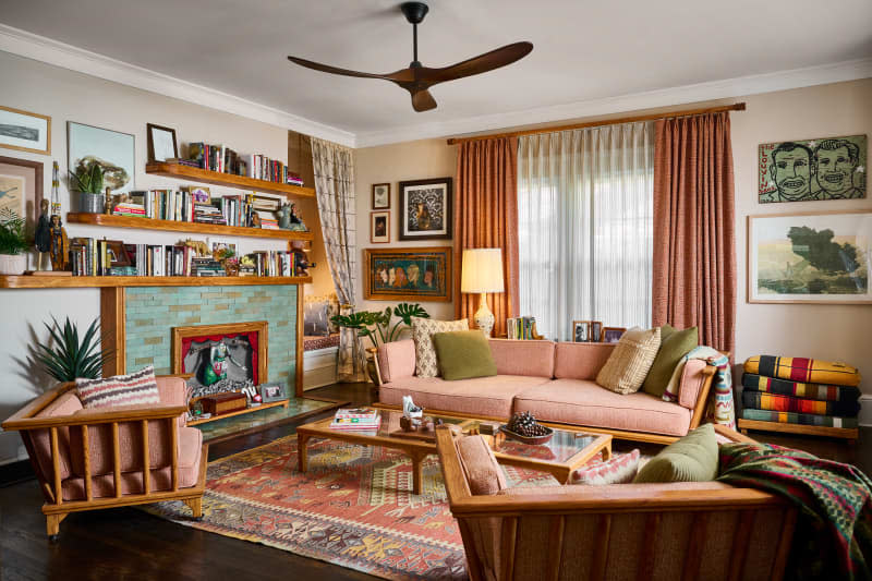 Pink sofa in eclectic living room.