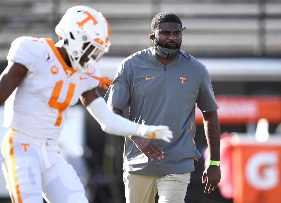 Tennessee defensive coordinator Derrick Ansley watches warmups before the game against Vanderbilt at Vanderbilt Stadium Saturday, Dec. 12, 2020 in Nashville, Tenn. 