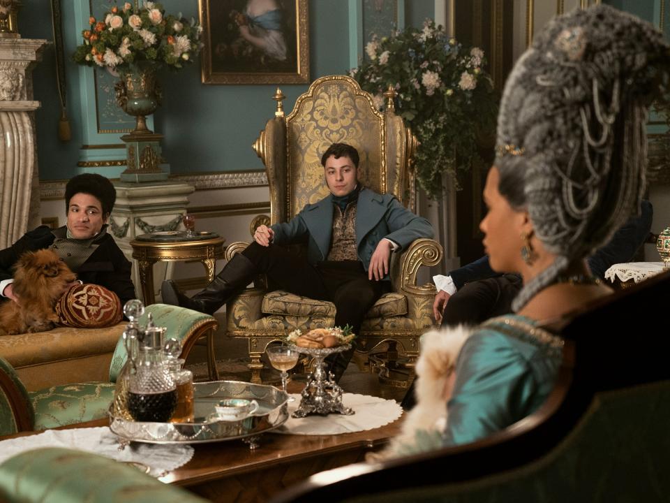 Joshua Riley as Prince Adolphus, Harvey Almond as Prince Ernest, Golda Rosheuvel as Queen Charlotte in episode 102 of Queen Charlotte: A Bridgerton Story