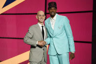 Evan Mobley, right, poses for a photo with NBA Commissioner Adam Silver after being selected third overall by the Cleveland Cavaliers during the NBA basketball draft, Thursday, July 29, 2021, in New York. (AP Photo/Corey Sipkin)