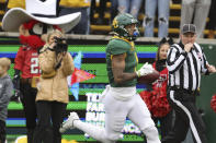 Baylor running back Trestan Ebner scores on a long pass play against Texas Tech in the first half of an NCAA college football game, Saturday, Nov. 27, 2021, in Waco, Texas. (Rod Aydelotte/Waco Tribune-Herald via AP)