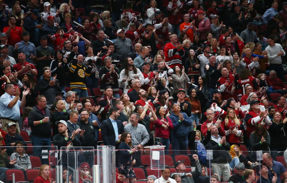 Fans cheer after the Arizona Coyotes scored against the Los Angeles Kings in the second period on Apr. 2, 2019 at Gila River Arena in Glendale, Ariz.