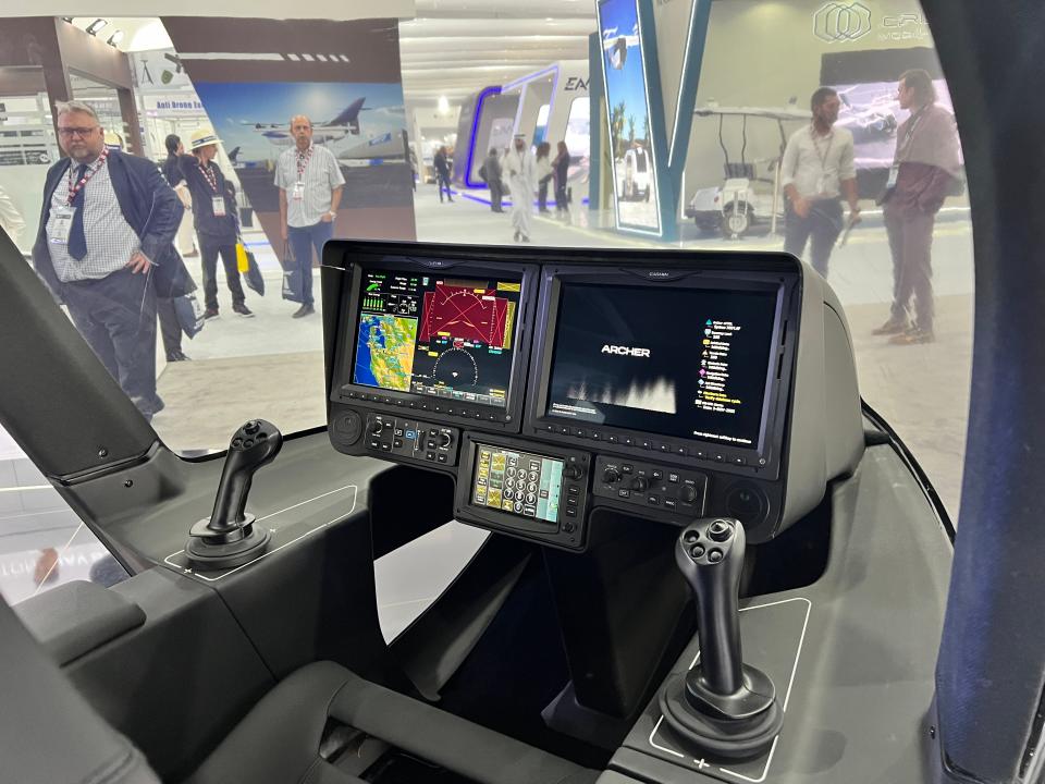 The cockpit of an Archer Midnight eVTOL has two joysticks, one seat, and two side-by-side screens