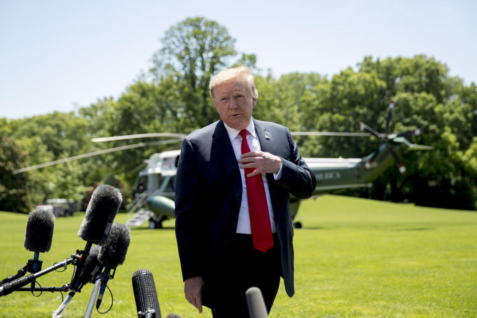 FILE - In this May 24, 2019 file photo, President Donald Trump speaks to members of the media on the South Lawn of the White House in Washington, before boarding Marine One for a short trip to Andrews Air Force Base, Md., and then on to Tokyo. Trump said the U.S. will bolster its military presence in the Middle East with an additional 1,500 troops. He said the troops will have a "mostly protective" role. (AP Photo/Andrew Harnik, File)