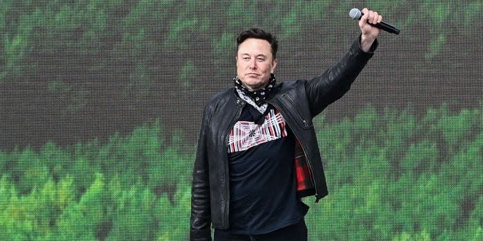 Elon Musk, Tesla CEO, stands on a stage at the Tesla Gigafactory for the open day