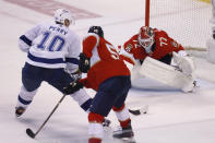 Tampa Bay Lightning right wing Corey Perry (10) crashes the net as Florida Panthers defenseman Aaron Ekblad (5) and goaltender Sergei Bobrovsky (72) defend during the third period of Game 1 of an NHL hockey second-round playoff series Tuesday, May 17, 2022, in Sunrise, Fla. (AP Photo/Reinhold Matay)