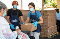 <p>Adam Brody and Leighton Meester hand out produce, beans, rice and other essential items while volunteering with Feeding America for a day of giving back at the Los Angeles Regional Food Bank on Sept. 10.</p>