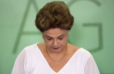 Brazil's President Dilma Rousseff attends a signing ceremony of land expropriation for agrarian reform and granting slave descendants, or Quilombolas, titles to their ancestral lands at the Planalto Palace in Brasilia, Brazil, April 1, 2016 . REUTERS/Adriano Machado