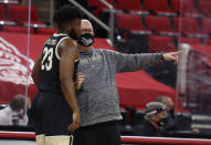 Wake Forest coach Steve Forbes talks with Isaiah Wilkins (23) during the first half of the team's NCAA college basketball game against North Carolina State on Wednesday, Jan. 27, 2021, in Raleigh, N.C. (Ethan Hyman/The News & Observer via AP, Pool)