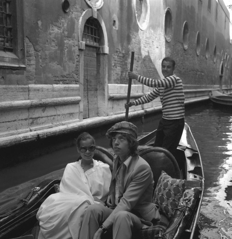 <p>Mick Jagger and his wife, Bianca, enjoy a romantic gondola ride in Venice, Italy in 1971. </p>