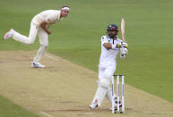 England's Stuart Broad, left, bowls to Pakistan's Mohammad Rizwan, right, during the second day of the second cricket Test match between England and Pakistan, at the Ageas Bowl in Southampton, England, Friday, Aug. 14, 2020. (Stu Forster/Pool via AP)