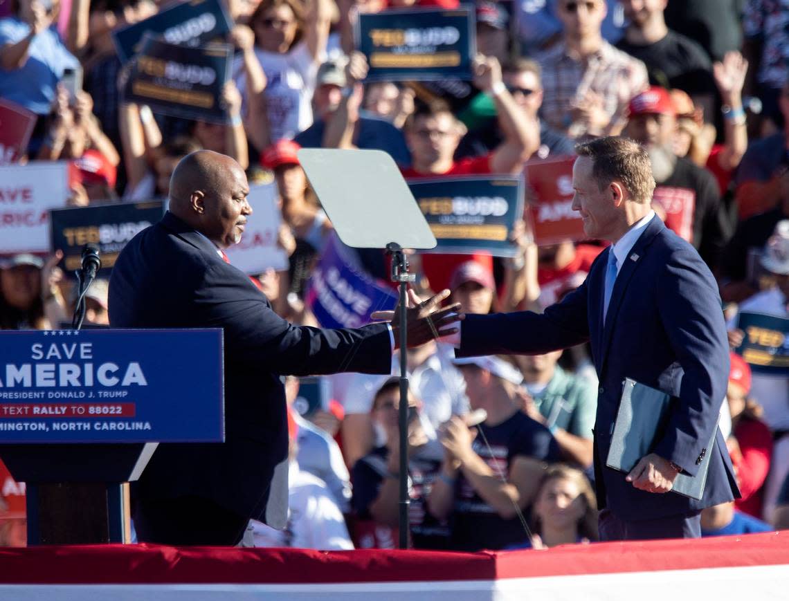 North Carolina Lt. Gov. Mark Robinson greets United States Senate candidate Ted Budd during a rally at Wilmington International Airport on Friday, Sept. 23, 2022.