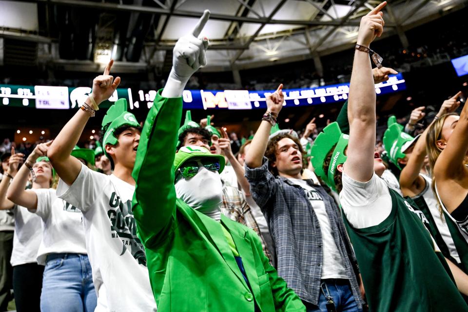 Michigan State fan Aiden Kalisz, dressed as Nintendo character Luigi, cheers during the Spartans game against Michigan on Tuesday, Jan. 30, 2024, at the Breslin Center in East Lansing.