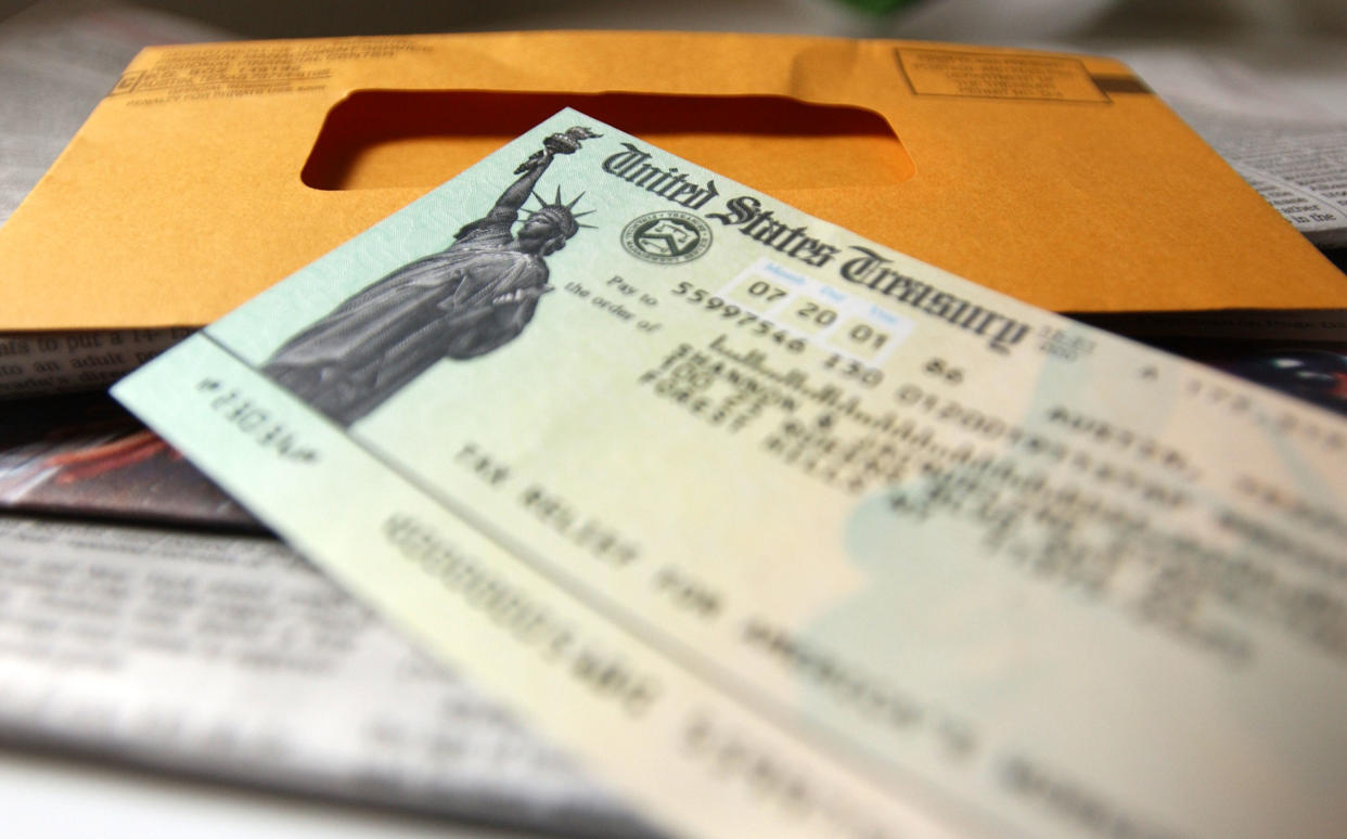 392397 01: A tax payer rebate check sits on a table July 25, 2001 in New York City. The U.S. government is sending out 92 million tax rebate checks over 10 weeks as part of the Bush administrations tax break. (Photo by Spencer Platt/Getty Images)