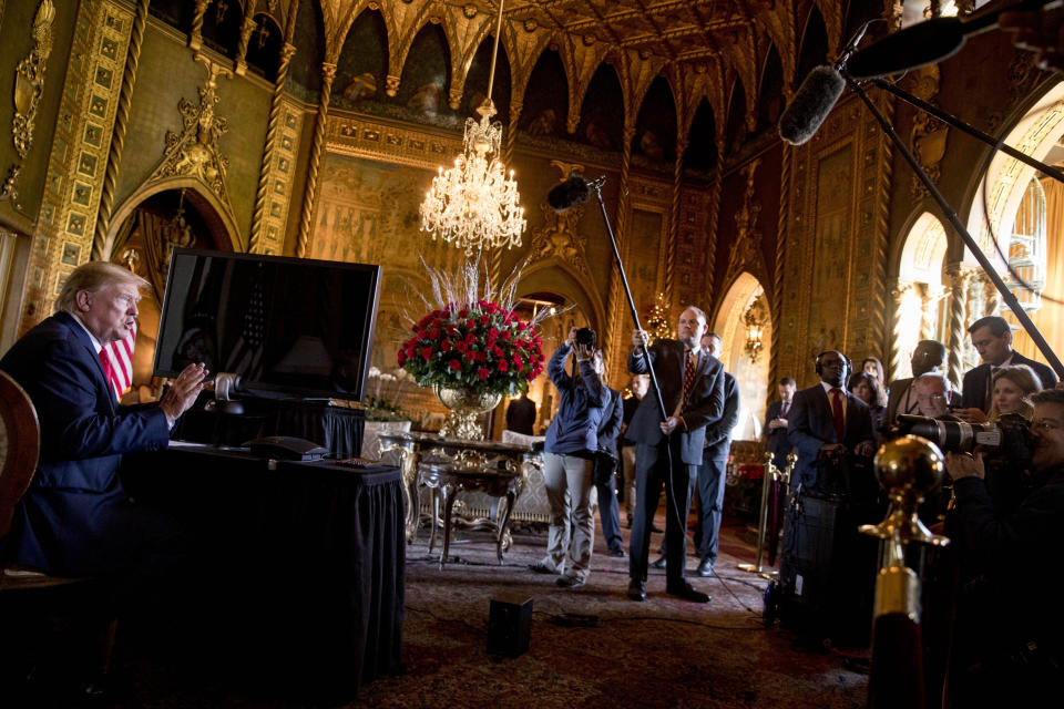 President Donald Trump speaks to members of the media following a Christmas Eve video teleconference with members of the military at his Mar-a-Lago estate in Palm Beach, Fla., Tuesday, Dec. 24, 2019. (AP Photo/Andrew Harnik)