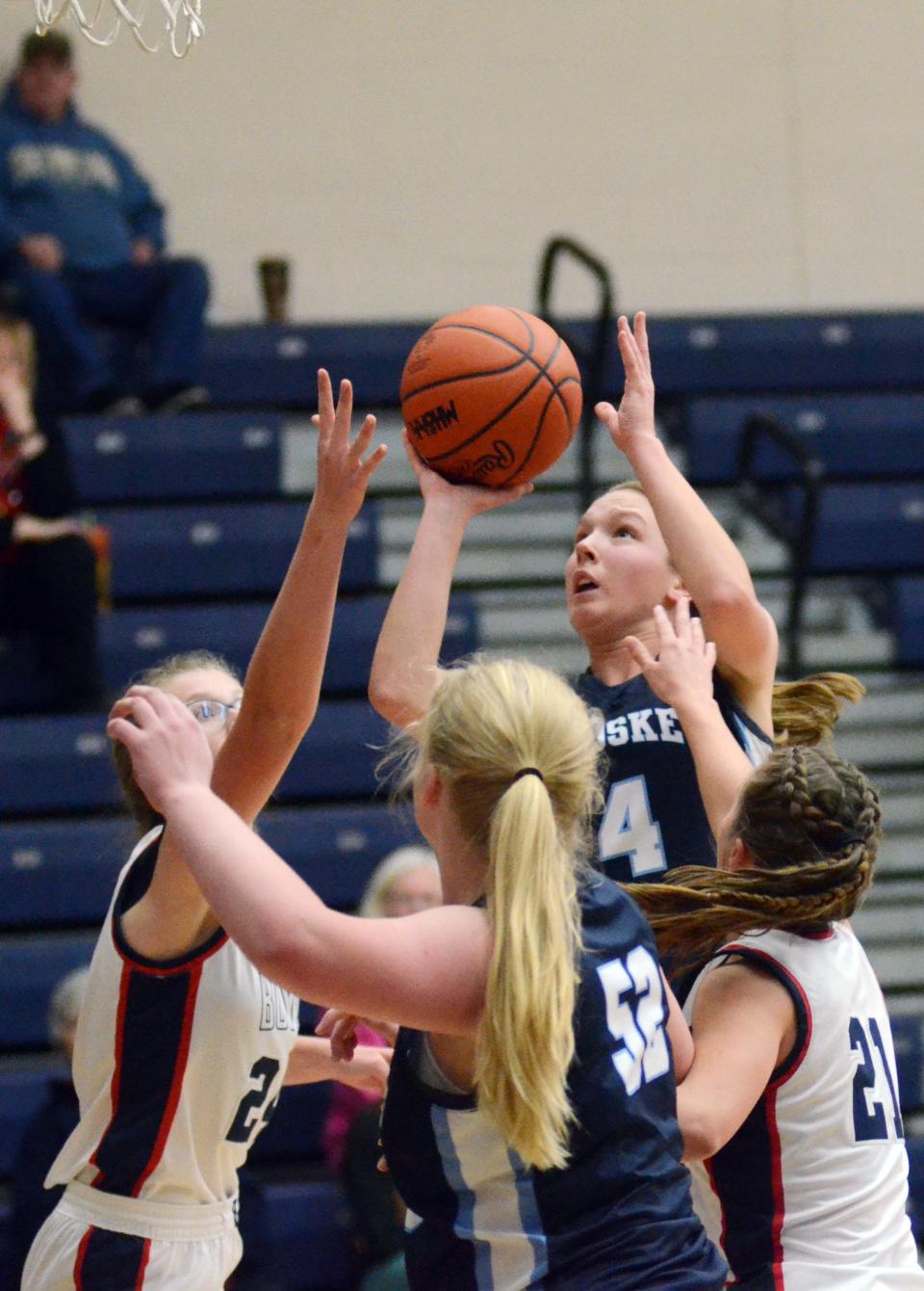 Petoskey's Kenzie Bromley elevates for a shot under the basket in traffic in the second half.