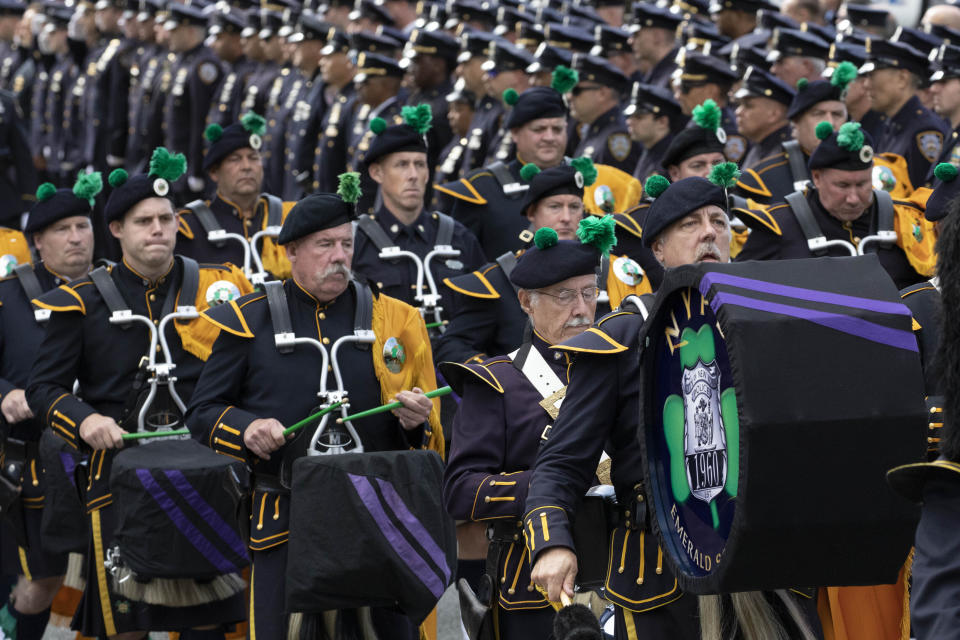 The New York Police Department Emerald Society Pipes and Drums corps marches following services for police officer Brian Mulkeen, Friday, Oct. 4, 2019 in Monroe, N.Y. Authorities say Mulkeen was fatally hit Sunday by two police bullets while struggling with an armed man in the Bronx. He is the second New York City officer killed by friendly fire this year. (AP Photo/Mark Lennihan)