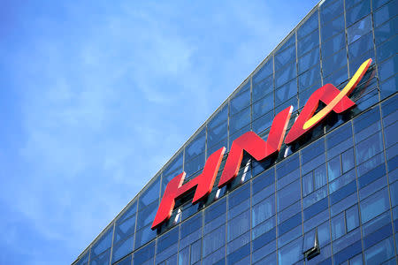 FILE PHOTO: A HNA Group logo is seen on the building of HNA Plaza in Beijing, China February 9, 2018. REUTERS/Jason Lee/File Photo