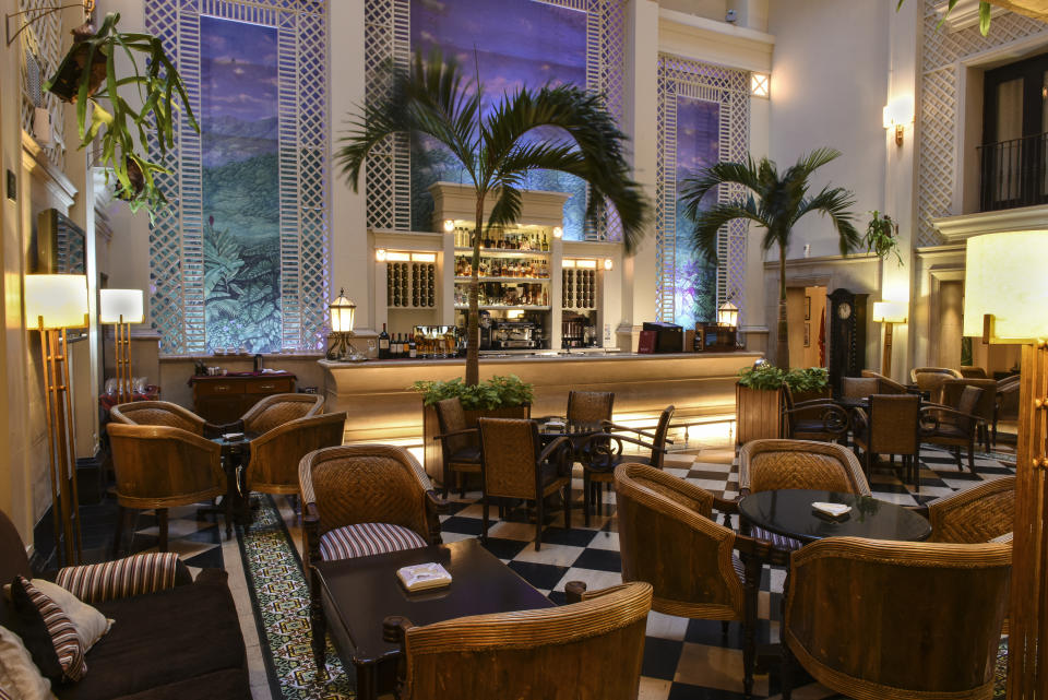 Sit back, sip on rum and take it all in in the hotel’s luxe mezzanine bar. Photo: Supplied