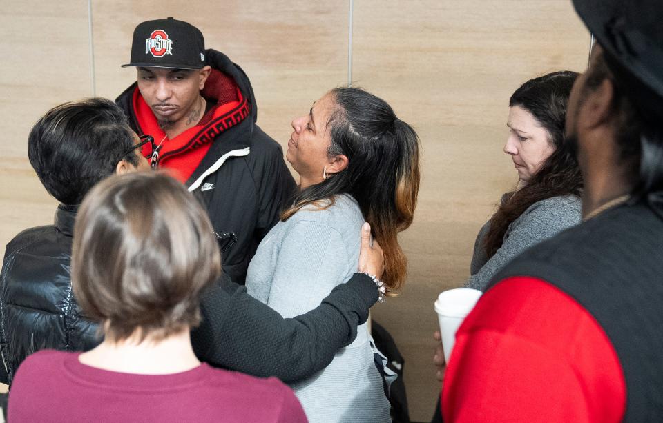 Feb 14 2024; Columbus, Ohio, USA; Tamala Payne is comforted by friends and family in the hallway outside of the courtroom while they wait for a verdict in the trial of Michael Jason Meade at the Franklin County Common Pleas Court.