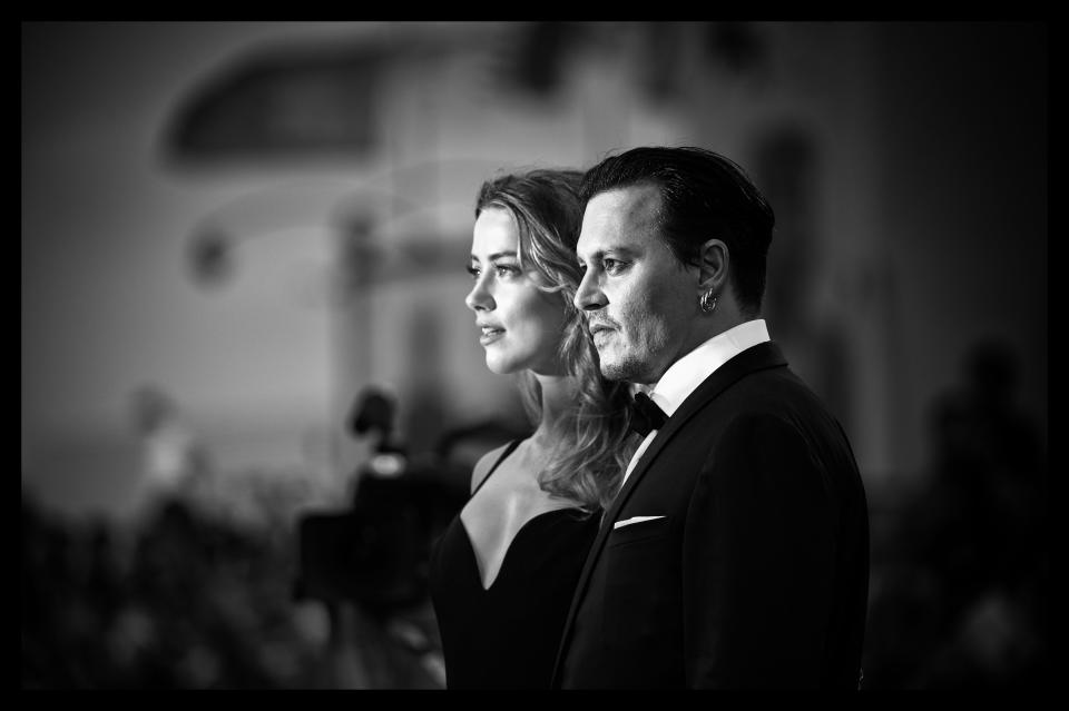VENICE, ITALY - SEPTEMBER 08:  (EDITORS NOTE: Image has been converted to black and white.) Amber Heard and Johnny Depp attend a premiere for 'Black Mass' during the 72nd Venice Film Festival on September 8, 2015 in Venice, Italy.  (Photo by Dominique Charriau/WireImage)