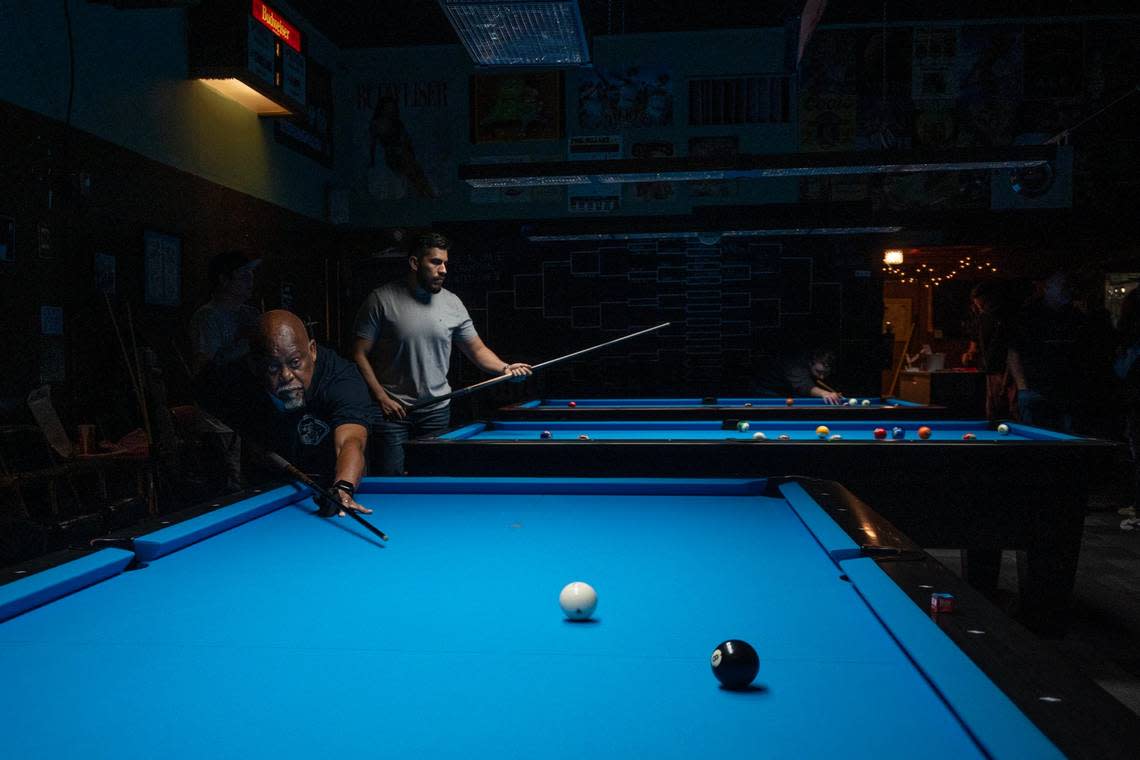 Calvin McGee lines up a shot on Thursday at Jointed Cue Billiards, a neighborhood pool hall in Hollywood Park.