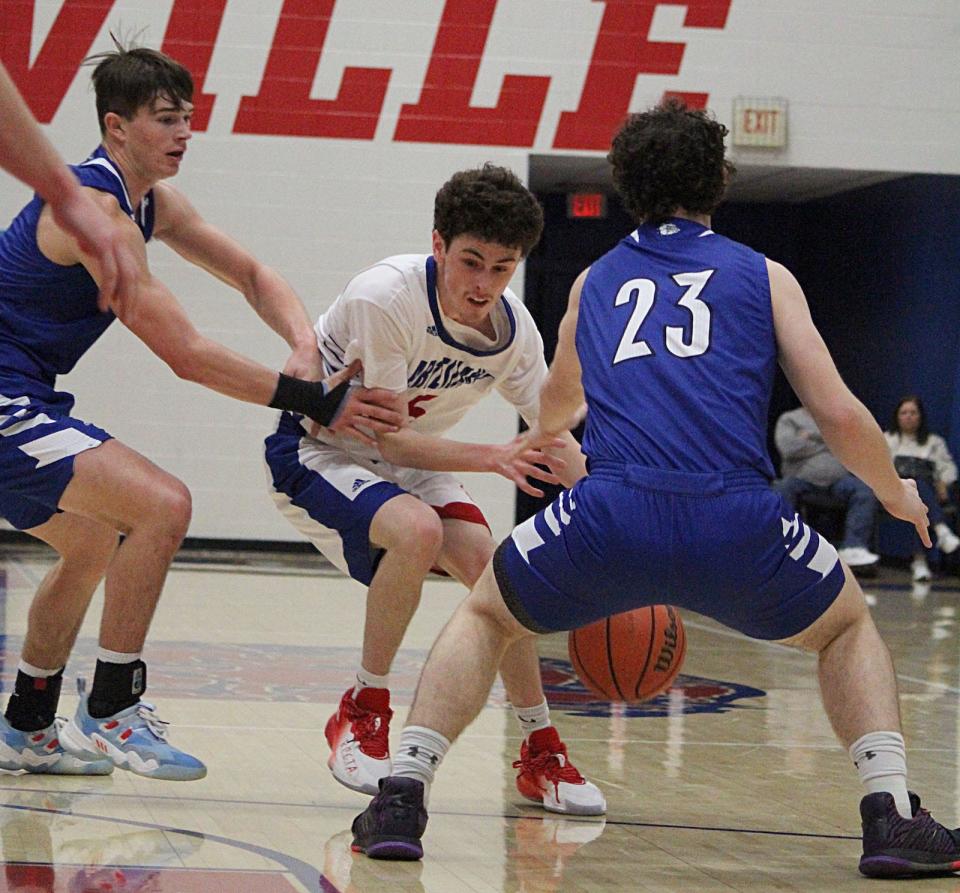 Martinsville senior Landon Myers dribbles through traffic during Saturday's home game against Columbus North.