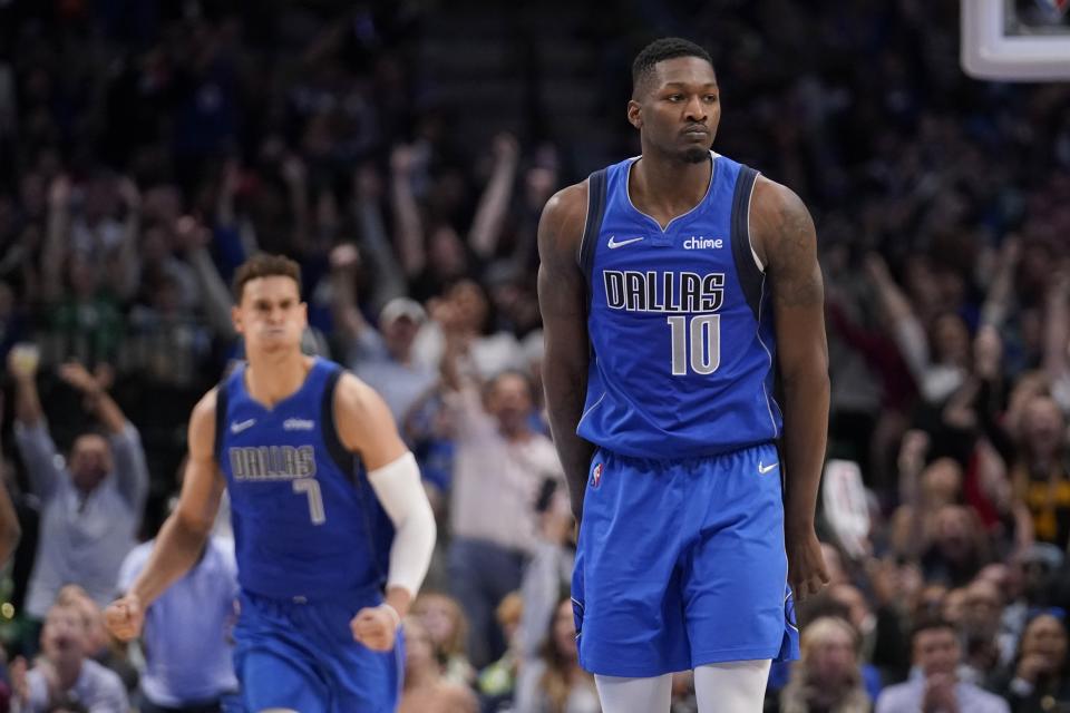 Dallas Mavericks forward Dorian Finney-Smith (10) celebrates sinking a three-point basket in the second half of an NBA basketball game against the Sacramento Kings in Dallas, Saturday, March, 5, 2022. (AP Photo/Tony Gutierrez)