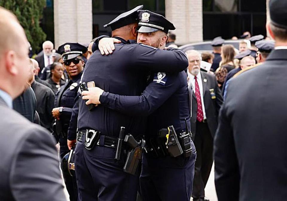 Law officers comfort each other outside First Baptist Church after the memorial service for officer Joshua Eyer on Friday, May3, 2024. Officer Eyer was killed while serving a warrant in east Charlotte on Monday, April 29, 2024