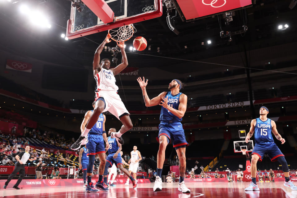 SAITAMA, JAPAN - JULY 25: Moustapha Fall #93 of Team France dunks the ball over JaVale McGee #11 of Team United States during the second half of the Men's Preliminary Round Group B game on day two of the Tokyo 2020 Olympic Games at Saitama Super Arena on July 25, 2021 in Saitama, Japan. (Photo by Gregory Shamus/Getty Images)