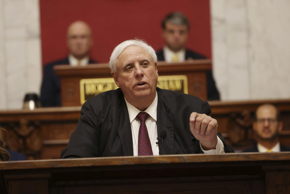 FILE - West Virginia Gov. Jim Justice delivers his annual State of the State address in the House Chambers at the West Virginia Capitol, Jan. 11, 2023, in Charleston, W.Va. The governors of Virginia, West Virginia and South Carolina on Wednesday, May 31, joined the growing list of Republican-led states sending soldiers or other state law enforcement officers to the U.S. border with Mexico. (AP Photo/Chris Jackson, File)