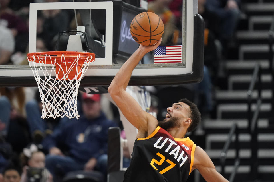 Utah Jazz center Rudy Gobert (27) dunks against the Detroit Pistons in the first half during an NBA basketball game Friday, Jan. 21, 2022, in Salt Lake City. (AP Photo/Rick Bowmer)