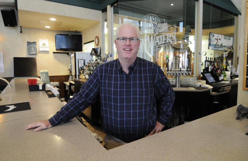 Great Waters Brewing Co., owner Sean O'Byrne poses for a photograph, Wednesday, Oct. 24, 2012 in St. Paul, Minn. at his brewpub located near the Xcel Arena, home of the Minnesota Wild NHL hockey team. O'Byrne's business is down 20 percent since the start of the NHL lockout and thatks a painful reminder of the 2004-05 lockout that wiped out the entire NHL season. (AP Photo/Jim Mone)