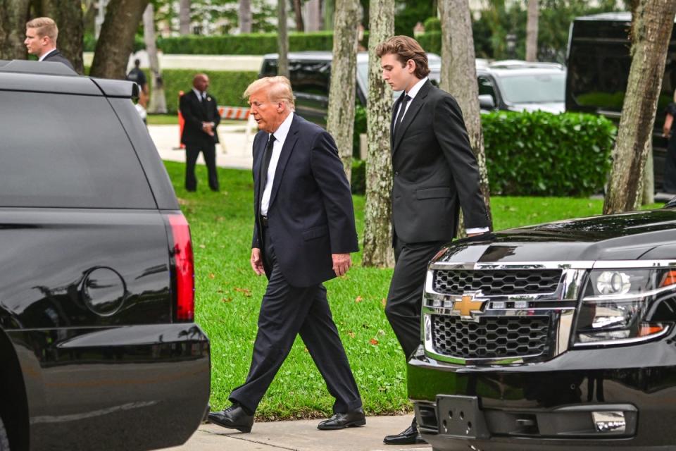 Donald Trump (left) and Barron Trump (right) attend a funeral for Melania Trump’s mother in January. Mr Trump recently told a local news outlet his 18-year-old son gives him political advice (AFP via Getty Images)