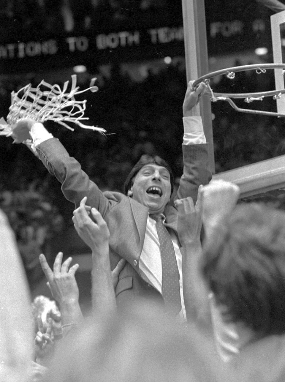 FILE - North Carolina State coach Jim Valvano waves the net in victory after defeating Houston in the NCAA Final Four championship game at The Pit in Albuquerque, N.M., April 5, 1983. New Mexico has made it the pits for plenty of teams over the years. (AP Photo/Leonard Ignelzi, File)