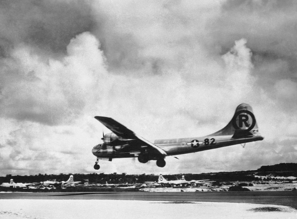FILE - In this Aug. 6, 1945, file photo, the "Enola Gay" Boeing B-29 Superfortress lands at Tinian, Northern Mariana Islands, after the U.S. atomic bombing mission against the Japanese city of Hiroshima. Enola Gay dropped the 4-ton “Little Boy” uranium bomb from a height of 9,600 meters (31,500 feet) on the city center, targeting the Aioi Bridge. (AP Photo/Max Desfor, File)