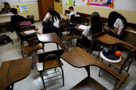 Empty desks are seen in the classroom of a school on a day of protests in Caracas, Venezuela June 14, 2017. REUTERS/Carlos Garcia Rawlins