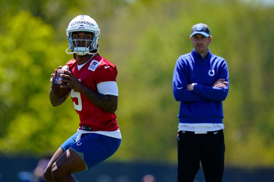 Indianapolis Colts quarterback Anthony Richardson throws in front of head coach Shane Steichen during a rookie camp.