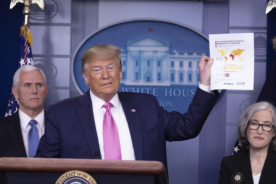 U.S. President Donald Trump, with Vice President Mike Pence, left, holds a briefing on the coronavirus from the White House on Feb. 26, 2020.