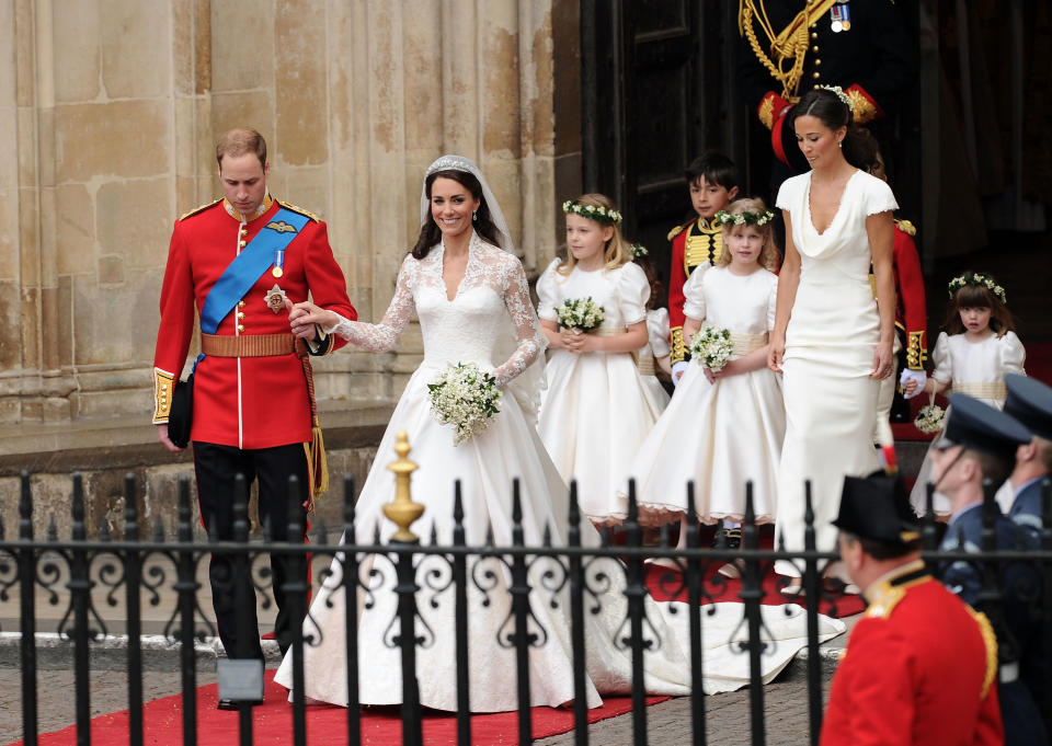 Prince William Duke of Cambridge (L) and Catherine Duchess of Cambridge (2nd to L) exit Westminster Abbey