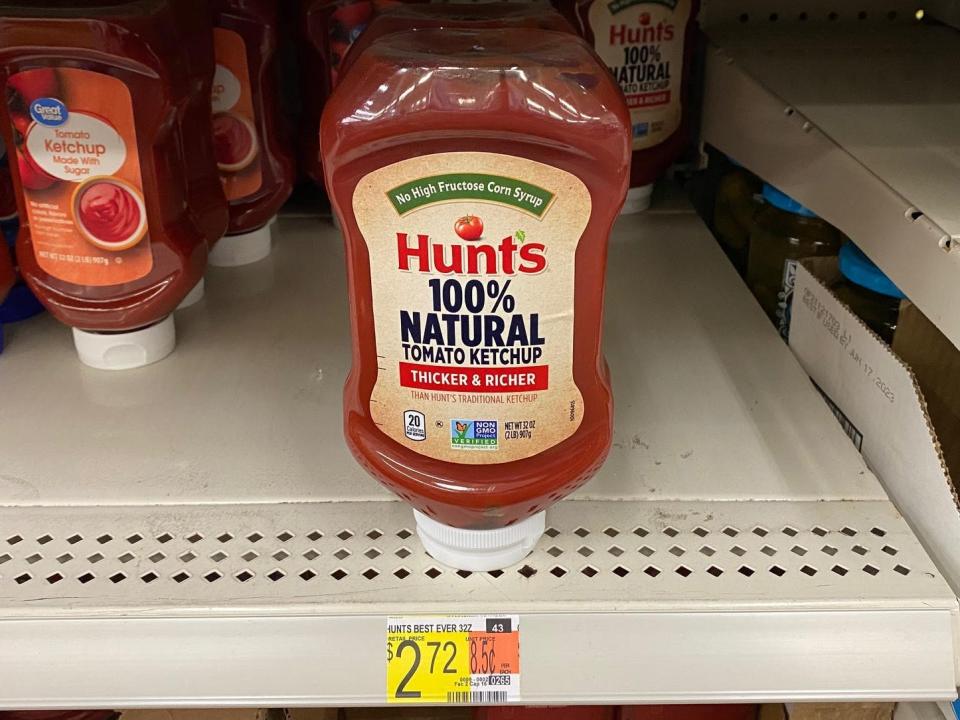 bottles of ketchup on the shelves at walmart