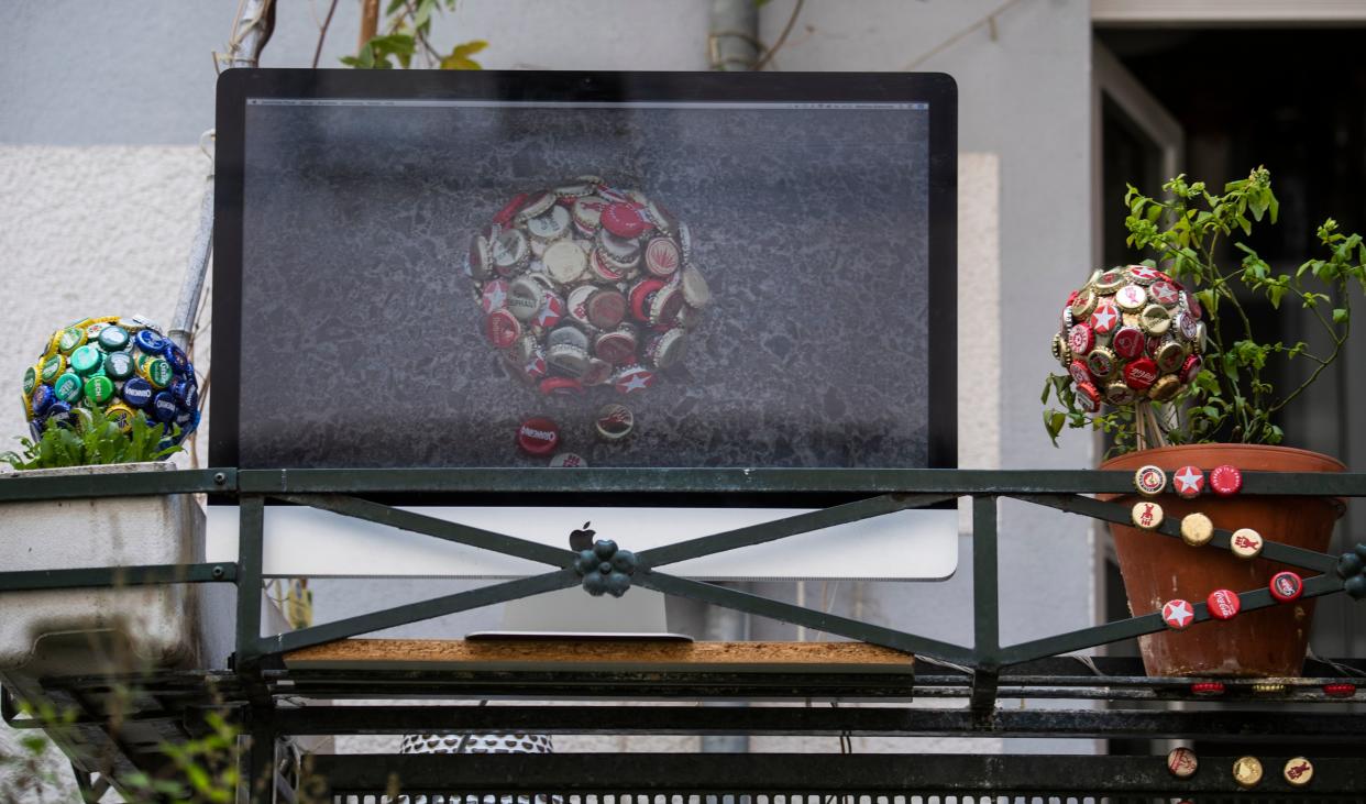 An art installation featuring a video screen, part of the "Balconies, Life, Art, Pandemic, and Proximity" exhibition, is seen in Berlin on April 12, 2020, amid a new coronavirus COVID-19 pandemic. - Over 30 artists are taking part in the two-day exhibition which calls on "the artistic community living in [Berlin's district of] Prenzlauer Berg to activate / exhibit / inhabit / their windows and balconies on Easter Sunday and Monday". Curated by Ovul Durmusoglu and Joanna Warsza, the exhibition boasts "zero budget, no openings, no crowds, just a proposition of a stroll that would connect dots in solidarity and togetherness". (Photo by John MACDOUGALL / AFP) (Photo by JOHN MACDOUGALL/AFP via Getty Images)